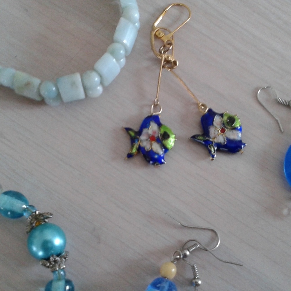 These are navy blue fish earrings